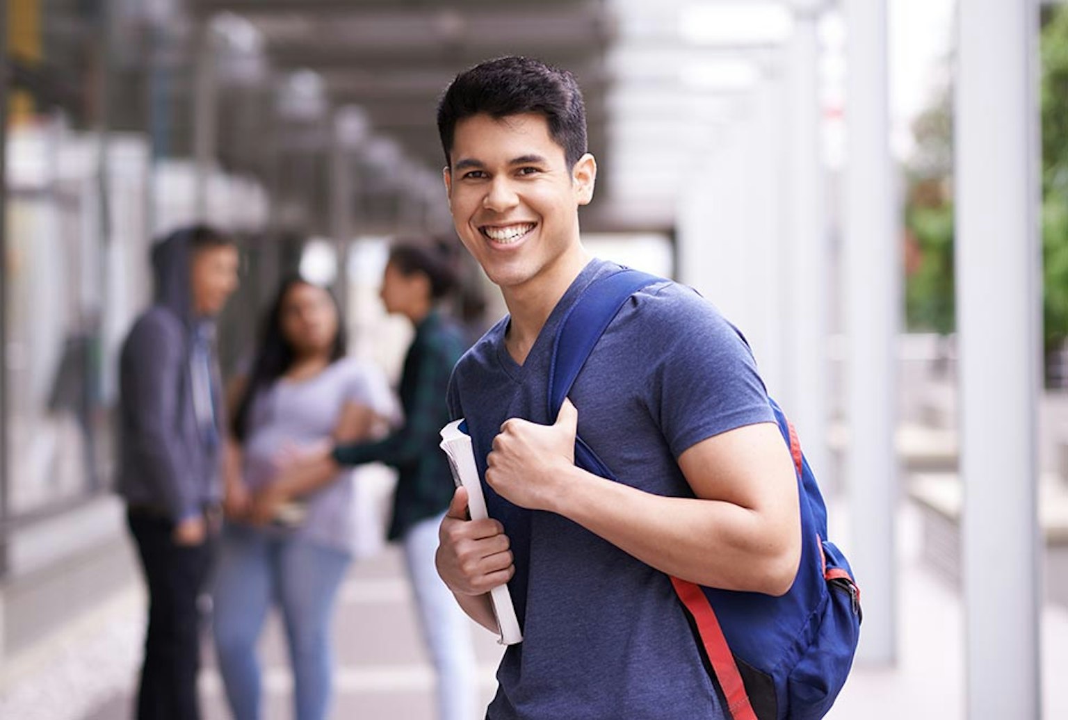 picture of student with backpack smiling